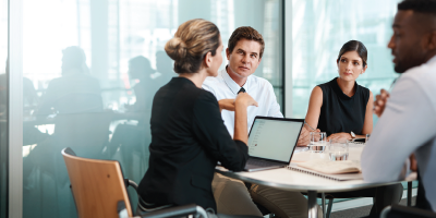 Shot of a group of businesspeople having a meeting in a modern office - problem solving and decision-making