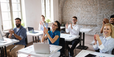A group of business people participating in a active learning environment in a modern room