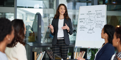 Shot of a young businesswoman giving a presentation in the boardroom - Effective Listening