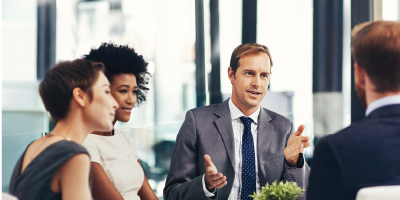 Shot of a group of businesspeople having a meeting in the boardroom - polarity thinking in the workplace
