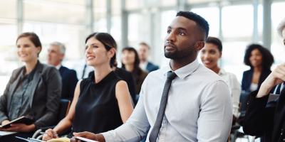 Shot of a group of businesspeople attending a conference