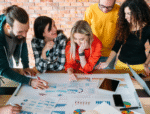 Embracing the Aspirations of Generation Z in the Workforce 14 Collaborative team of generation z professionals analyzing data together at work.